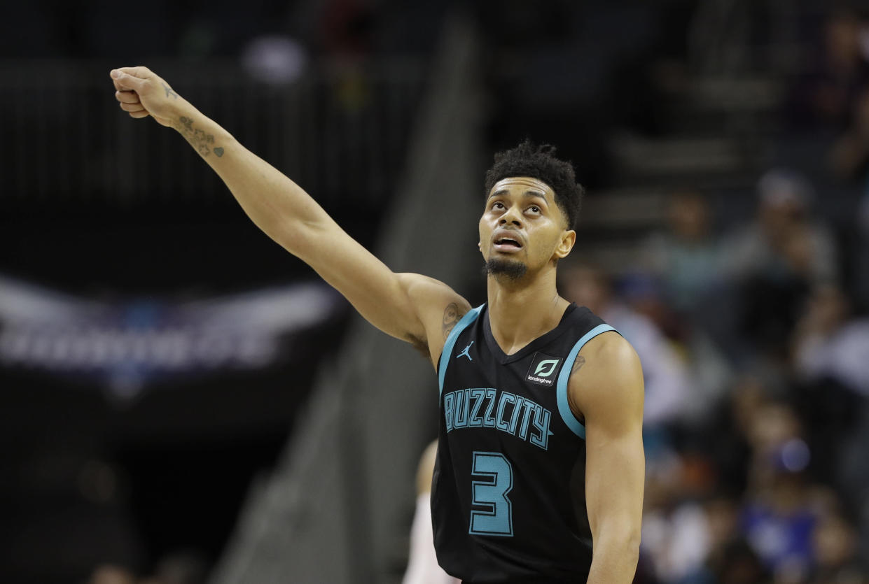 Charlotte Hornets' Jeremy Lamb (3) reacts after a basket against the Philadelphia 76ers during the second half of an NBA basketball game in Charlotte, N.C., Tuesday, March 19, 2019. (AP Photo/Chuck Burton)