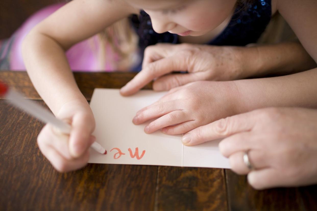 girl writing a card