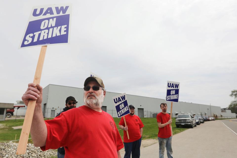 Members of United Auto Workers Local 807 picket after going on strike May 2, 2022, at a CNH plant in Burlington.