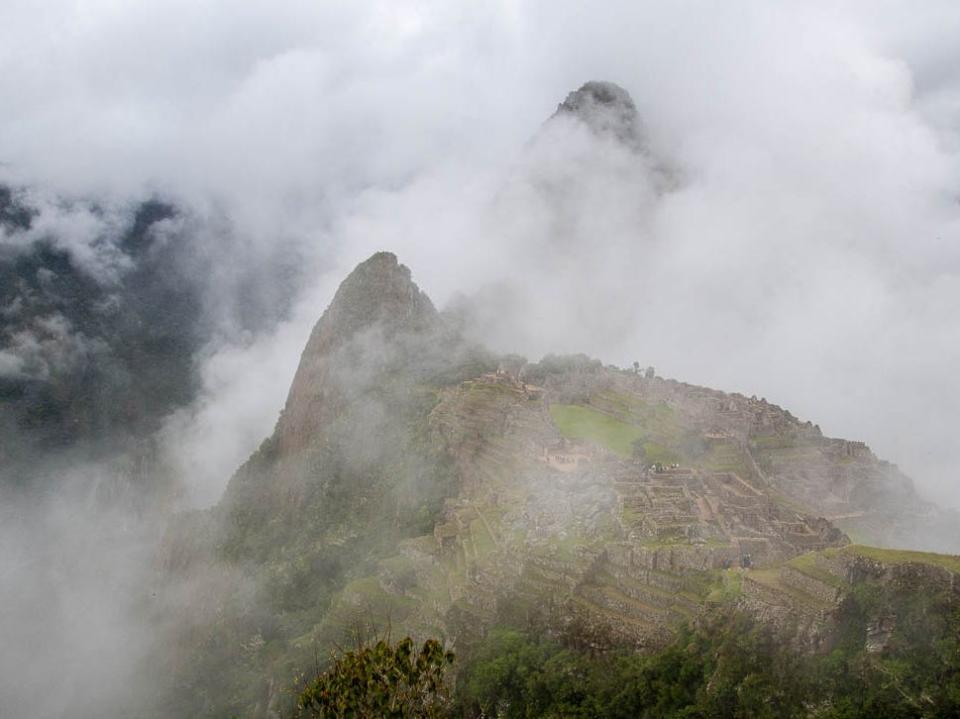 A birds-eye view of the ruins of Machu Picchu on a foggy day, Marci Vaughn Kolt 9 mistakes tourists make when visiting Machu Picchu