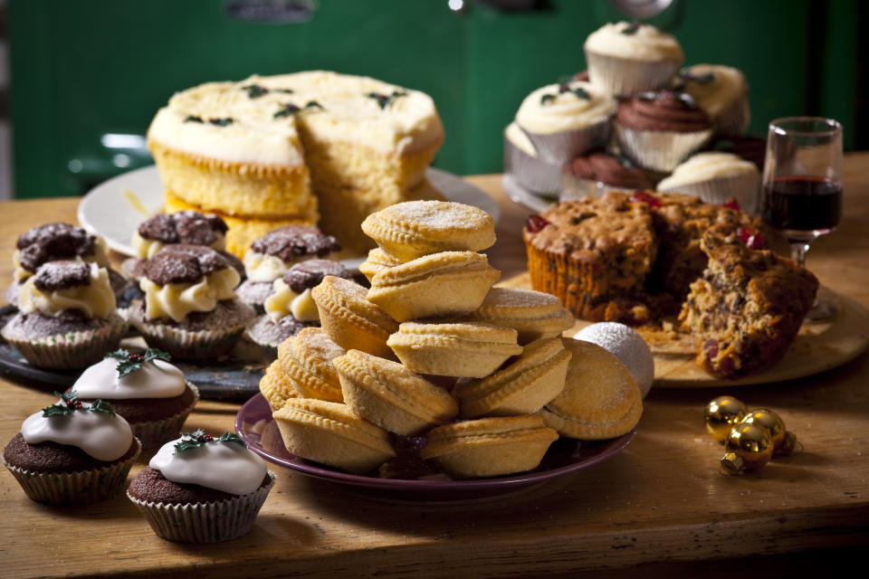 Selection of homemade rustic baked goods such as sweet pies and cupcakes shot in a home kitchen setting, Newport, Wales, 2010