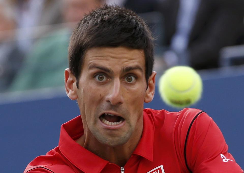 Djokovic of Serbia hits a return to Nadal of Spain during their men's final match at the U.S. Open tennis championships in New York