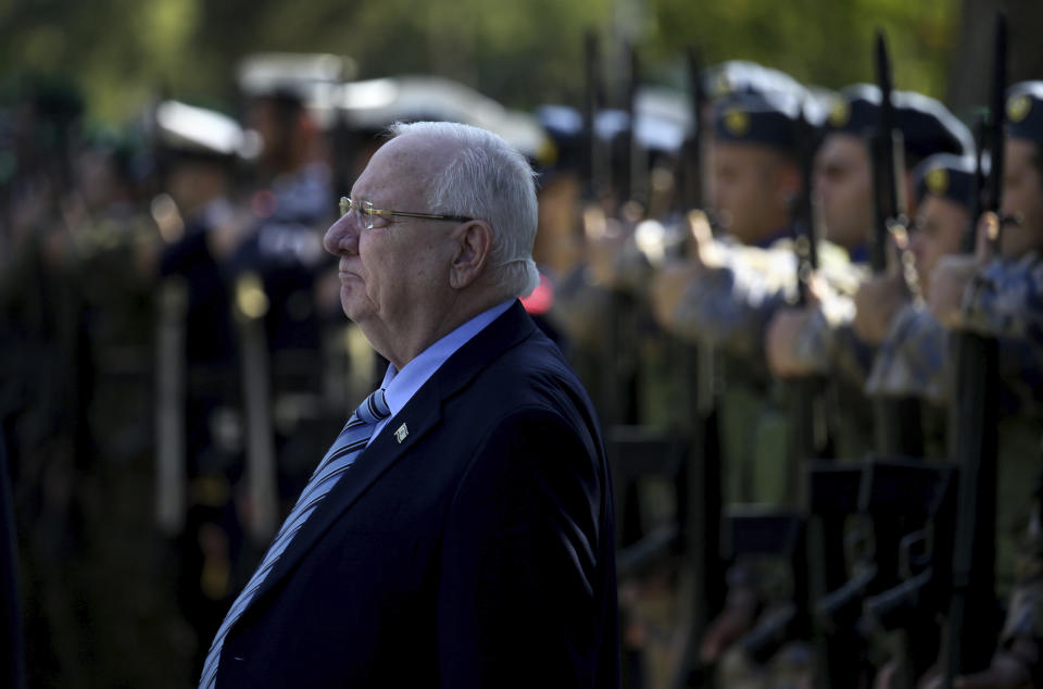 Israel's President Reuven Rivlin reviews a military guard of honor during a welcoming ceremony before a meeting with Cyprus' president Nicos Anastasiades at the presidential palace in divided capital Nicosia, Cyprus, on Tuesday, Feb. 12, 2019. Rivlin is in Cyprus for one-day official visit for talks. (AP Photo/Petros Karadjias)