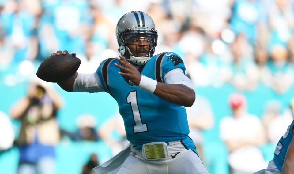 Carolina Panthers quarterback Cam Newton (1) drops back to pass against the Miami Dolphins during the first quarter  of an NFL game at Hard Rock Stadium in Miami Gardens, Nov. 28, 2021. 