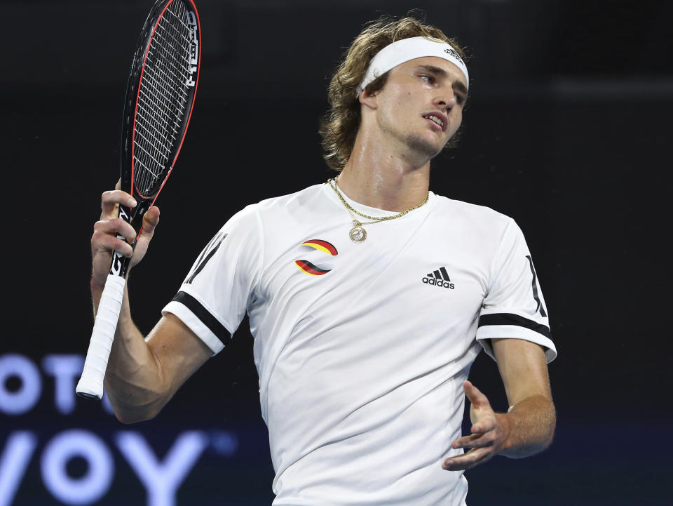 Alexander Zverev of Germany reacts after missing a shot during his match against Stefanos Tsitsipas of Greece at the ATP Cup tennis tournament in Brisbane, Australia, Sunday, Jan. 5, 2020. (AP Photo/Tertius Pickard)
