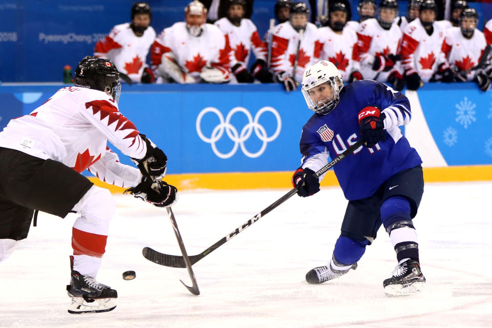 <p>Jocelyne Lamoureux #17 of the United States shoots the puck around Lauriane Rougeau #5 of Canada in overtime during the Women’s Gold Medal Game on day thirteen of the PyeongChang 2018 Winter Olympic Games at Gangneung Hockey Centre on February 22, 2018 in Gangneung, South Korea. (Photo by Jamie Squire/Getty Images) </p>