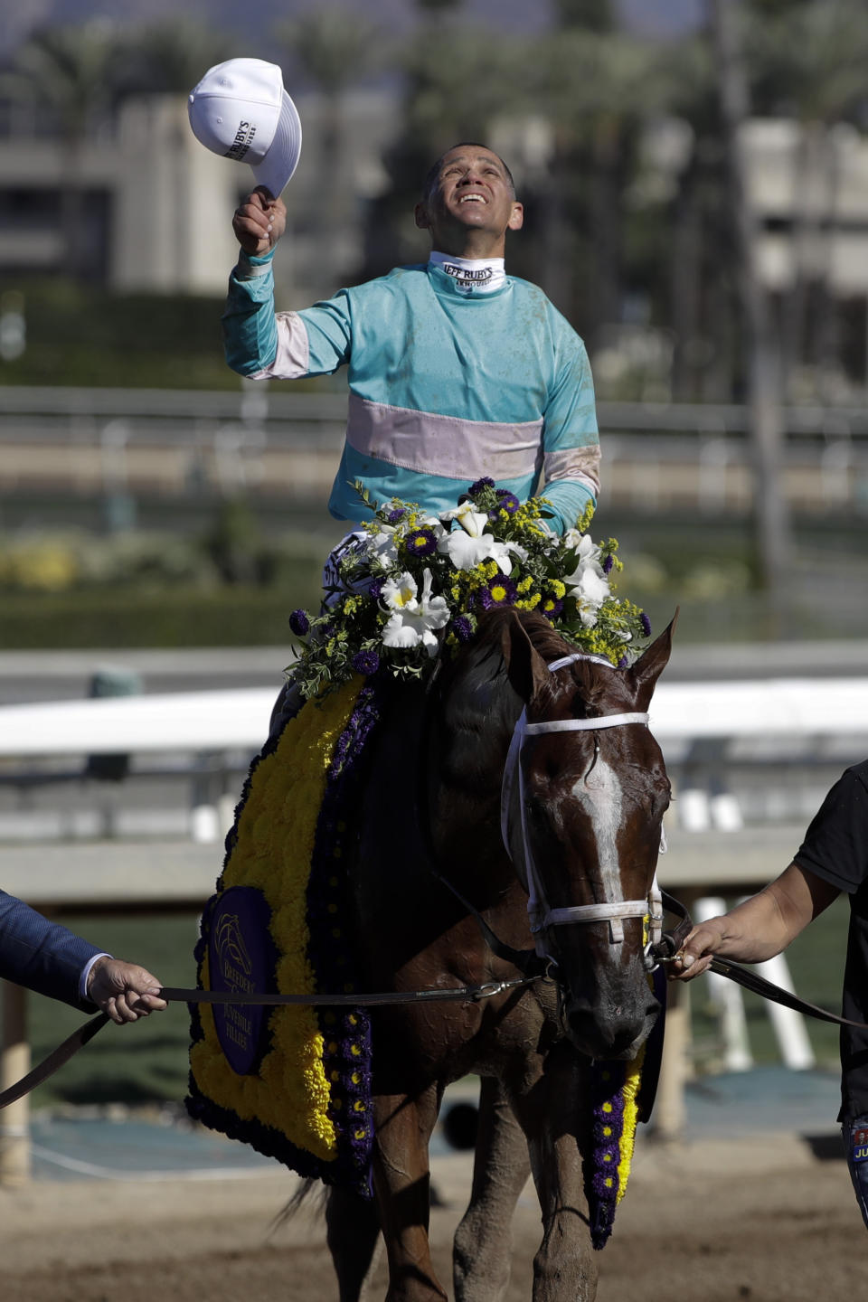 Javier Castellano, abroad British Idiom celebrates after winning the Breeders' Cup Juvenile Fillies horse race at Santa Anita Park, Friday, Nov. 1, 2019, in Arcadia, Calif. (AP Photo/Gregory Bull)