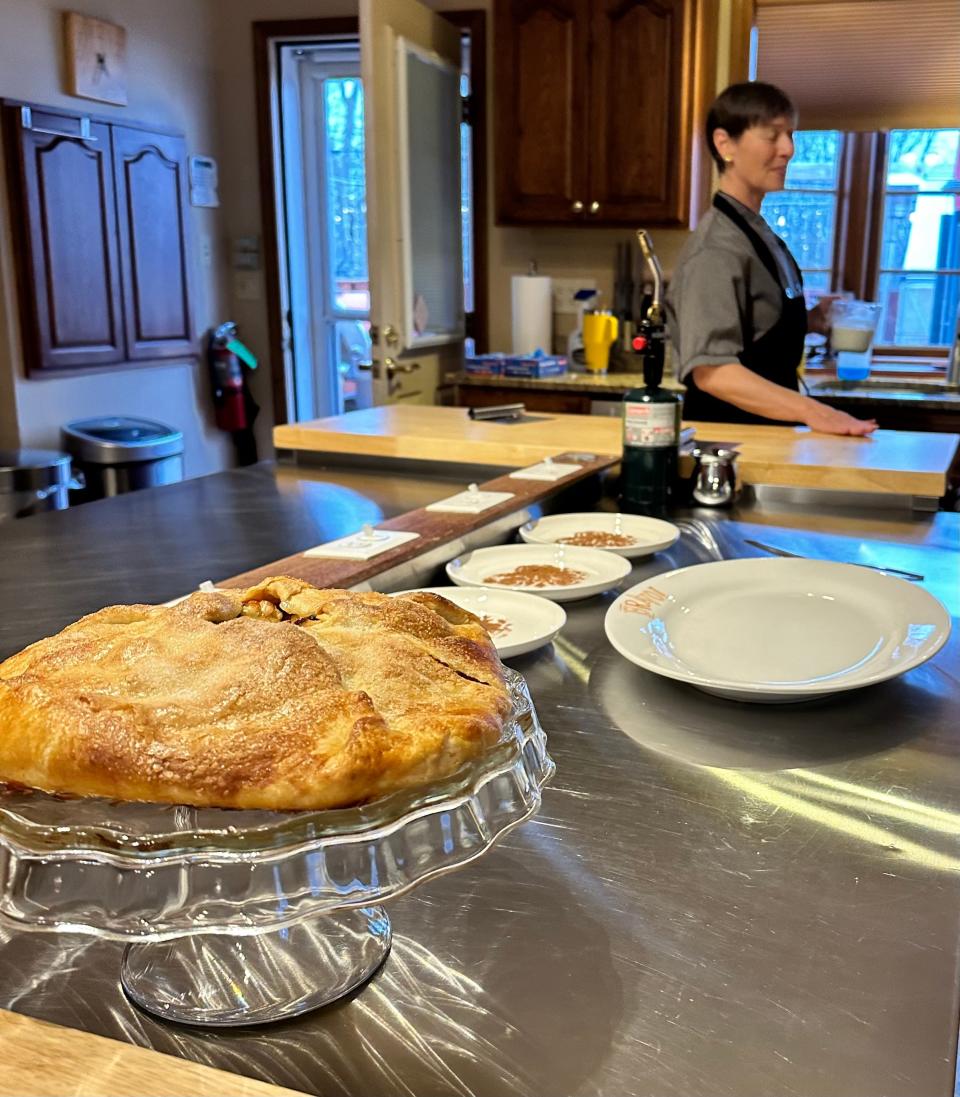 With an apple-raisin-almond crostada already prepared, Chef Angela Marie Perkins still has much to do in her chef's kitchen at the bed and breakfast.