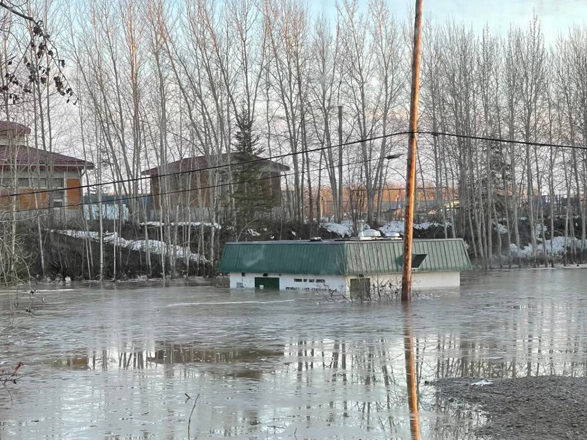 Lift station No. 1, which services much of Hay River, N.W.T., was almost entirely submerged during flooding earlier this month. Town officials reported it was back online Sunday. (Submitted by Jane Groenewegen - image credit)