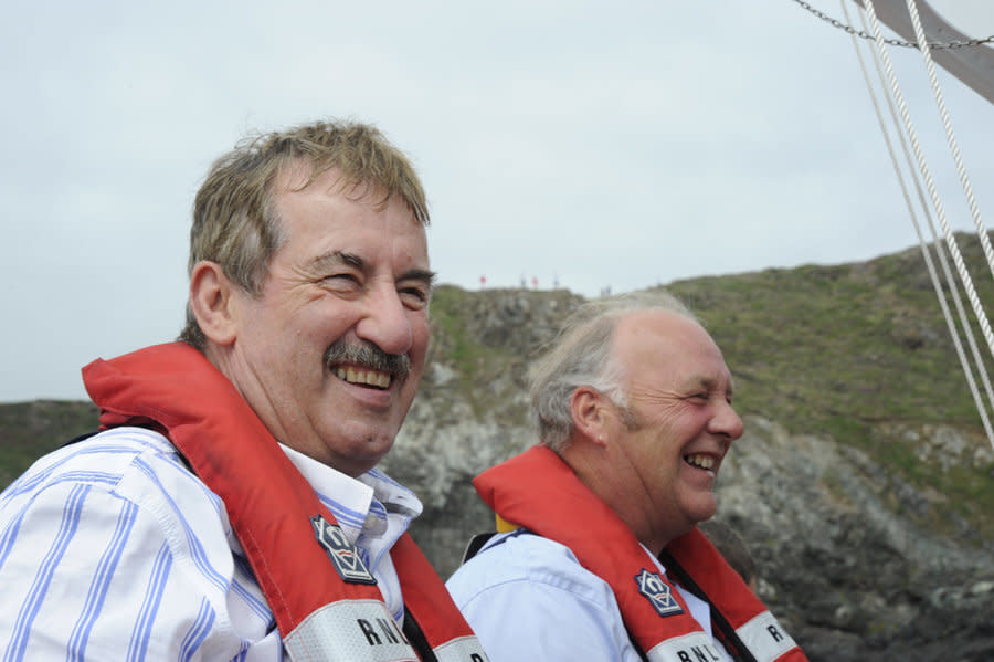 These pictures show Boycie actor John Challis ticking off one of his bucket list wishes before he died - launching down the slipway of a lifeboat station (August 09). See SWNS story SWPLboycie; Tributes have been paid to John Challis, best known for playing Boycie in BBC sitcom Only Fools and Horses, who has died at the age of 79. His family said he died 