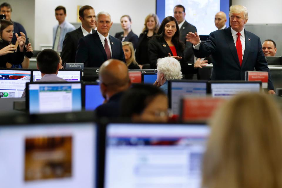 President Donald Trump tours Federal Emergency Management Agency headquarters in Washington, Aug. 4, 2017, with acting Homeland Security Secretary Elaine Duke and Vice President Mike Pence.