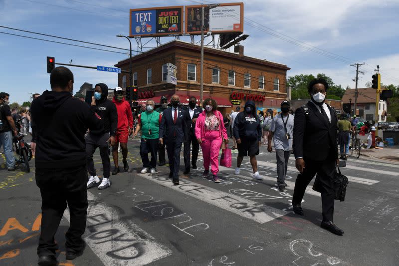 Civil rights activist Reverend Al Sharpton and Gwen Carr, mother of Eric Garner, lead a prayer at the site where African-American man George Floyd was fatally injured by police in Minneapolis