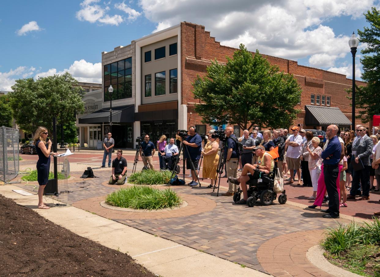 Candace Chapman, director of downtown development for E-REP, addresses the crowd ahead of the groundbreaking for The Vault on Main in Downtown Evansville, Tuesday, May 28, 2024.