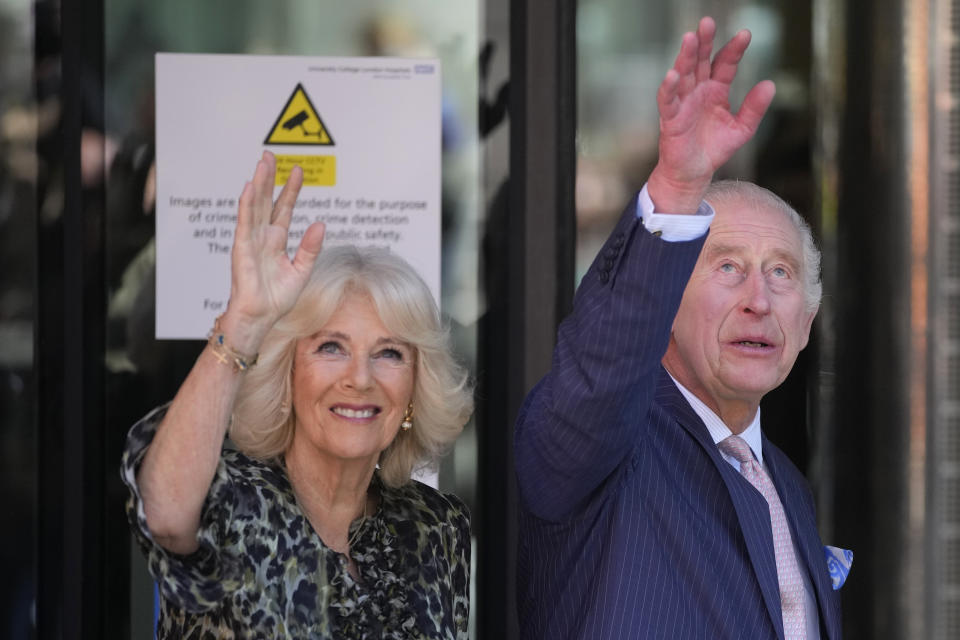 Britain's King Charles III and Queen Camilla wave as they arrive for a visit to University College Hospital Macmillan Cancer Centre in London, Tuesday, April 30, 2024. The King, Patron of Cancer Research UK and Macmillan Cancer Support, and Queen Camilla visited the University College Hospital Macmillan Cancer Centre, meeting patients and staff. This visit is to raise awareness of the importance of early diagnosis and will highlight some of the innovative research, supported by Cancer Research UK, which is taking place at the hospital. (AP Photo/Kin Cheung)