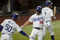 Los Angeles Dodgers' Enrique Hernandez celebrates his home run with Corey Seager against the Atlanta Braves during the fifth inning in Game 1 of a baseball National League Championship Series Monday, Oct. 12, 2020, in Arlington, Texas.(AP Photo/Eric Gay)