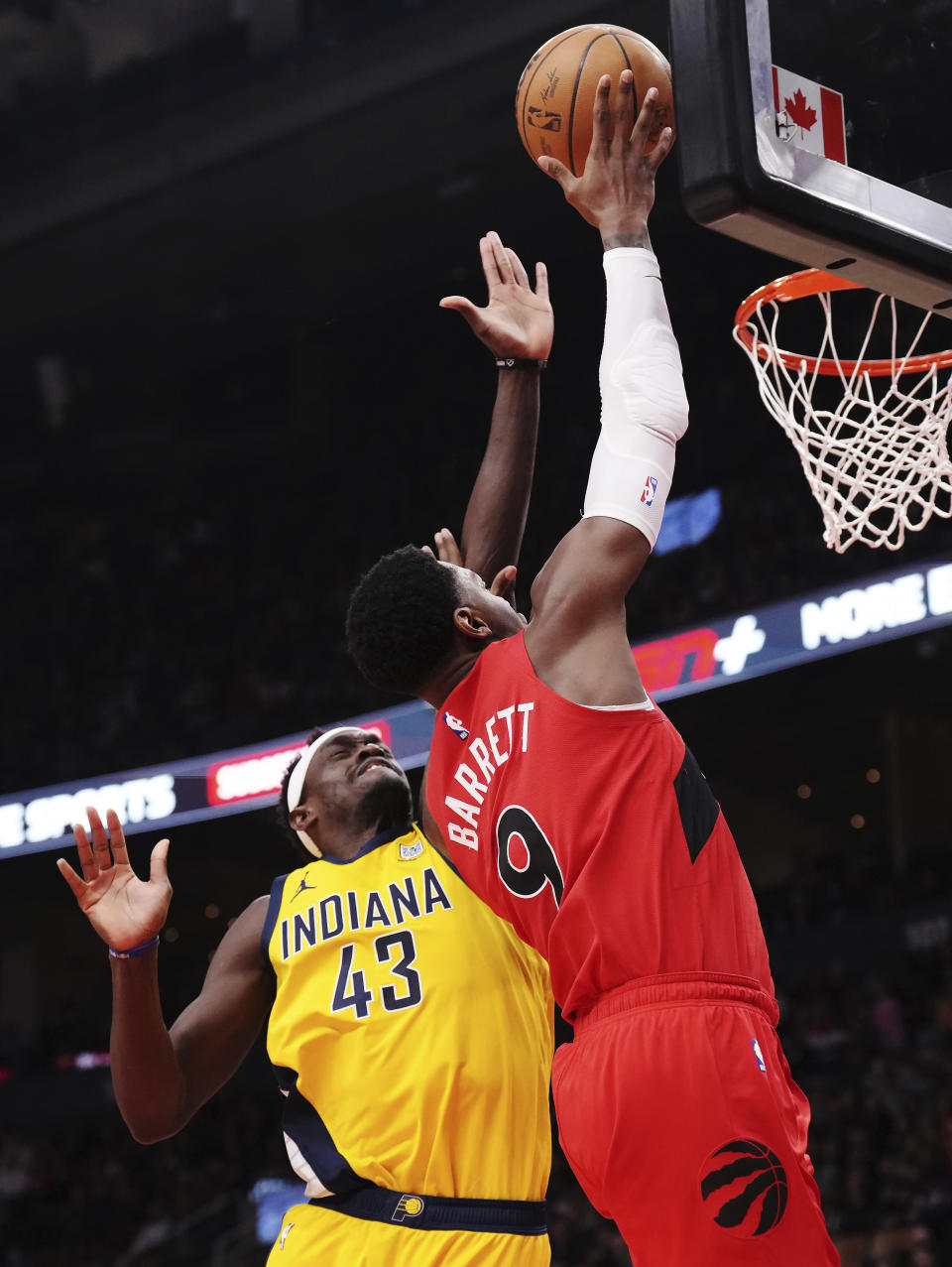 Toronto Raptors guard RJ Barrett (9) scores past Indiana Pacers forward Pascal Siakam (43) during the first half of an NBA basketball game Wednesday, Feb. 14, 2024, in Toronto. (Chris Young/The Canadian Press via AP)