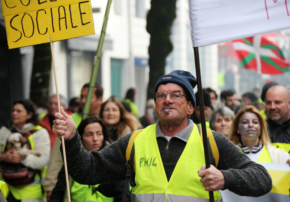 A yellow vest protester demonstrates in Saint Jean De Luz, France, Saturday, Jan. 19, 2019. Yellow vest protesters are planning rallies in several French cities despite a national debate launched this week by President Emmanuel Macron aimed at assuaging their anger.(AP Photo/Bob Edme)