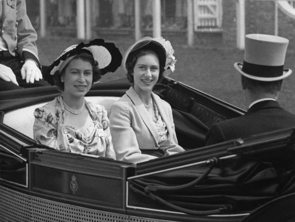 The Queen, then Princess Elizabeth, and her sister Princess Margaret at Royal Ascot in 1949. (PA)
