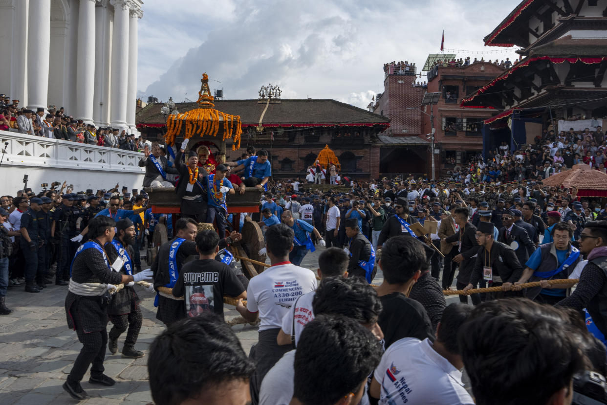 Devotees pull the chariot during Indra Jatra, a festival that marks the end of the rainy season in Kathmandu, Nepal, Tuesday, Sept. 17, 2024. (AP Photo/Niranjan Shrestha)