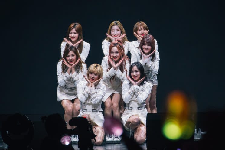 TWICE in white military band-inspired uniforms at their concert in Singapore (Photo: ONE Production)