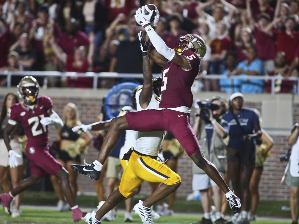 Florida State wide receiver Deuce Spann (5) leaps for a catch but Southern Mississippi cornerback Markel McLaurin knocks the ball away in the first quarter of an NCAA college football game Saturday, Sept. 9, 2023, in Tallahassee, Fla. (AP Photo/Phil Sears)