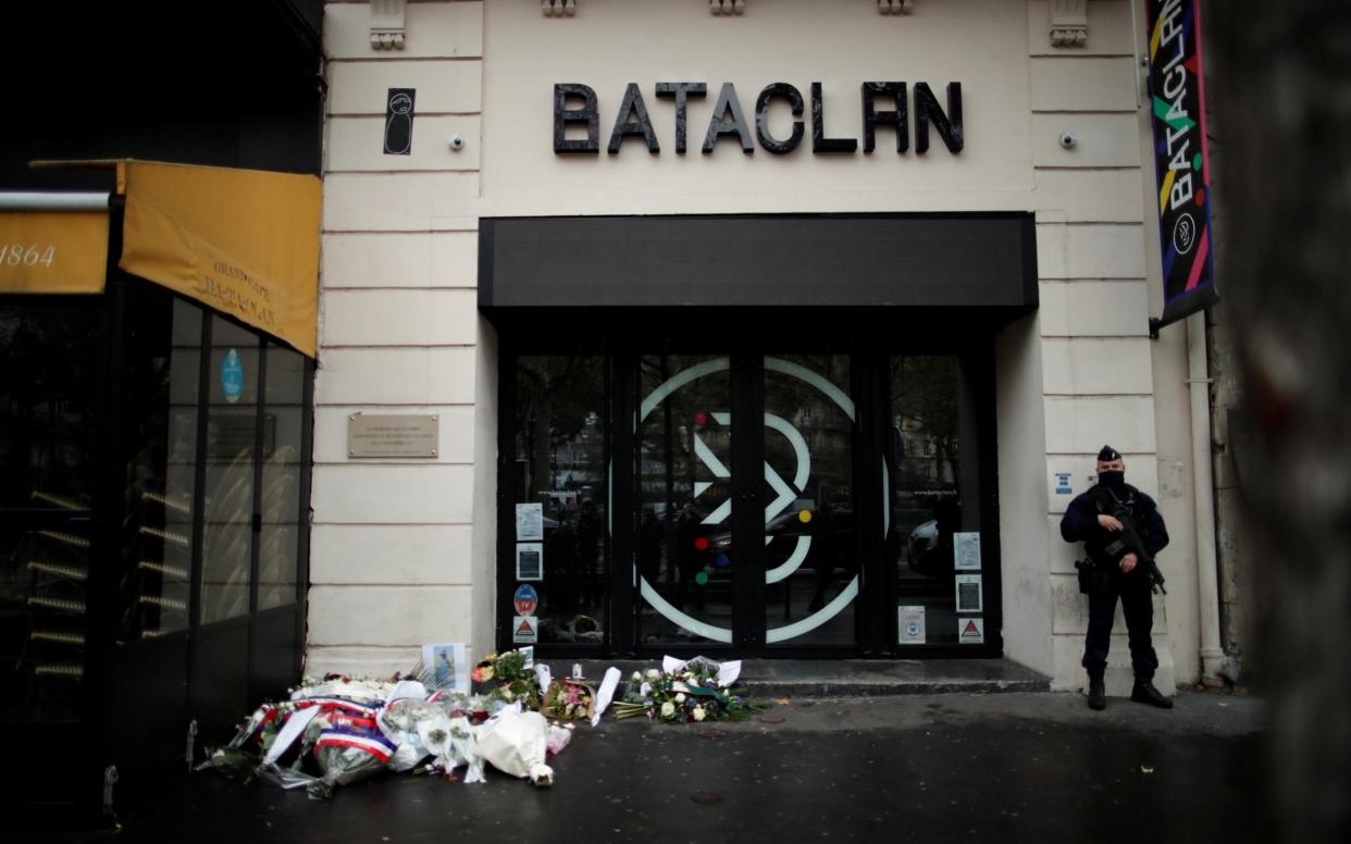 A French policeman stands guard in front of the Bataclan concert venue during a ceremony marking the fifth anniversary of the deadly terrorist attacks in Paris, November 13, 2020 - Reuters