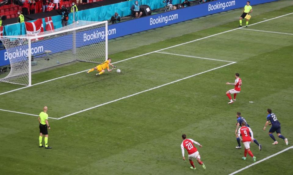 Finland’s Lukas Hradecky saves a penalty from Denmark’s Pierre-Emile Højbjerg