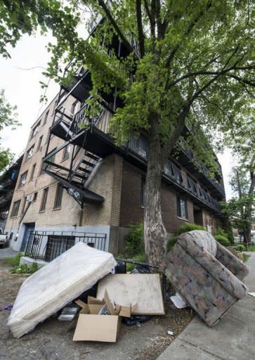 A mattress and sofa reportedly taken out of the apartment of Luka Rocco Magnotta lie just outside an apartment building in Montreal in May 2012. Magnotta is also accused of harassing the country's prime minister and other lawmakers, according to an arrest warrant