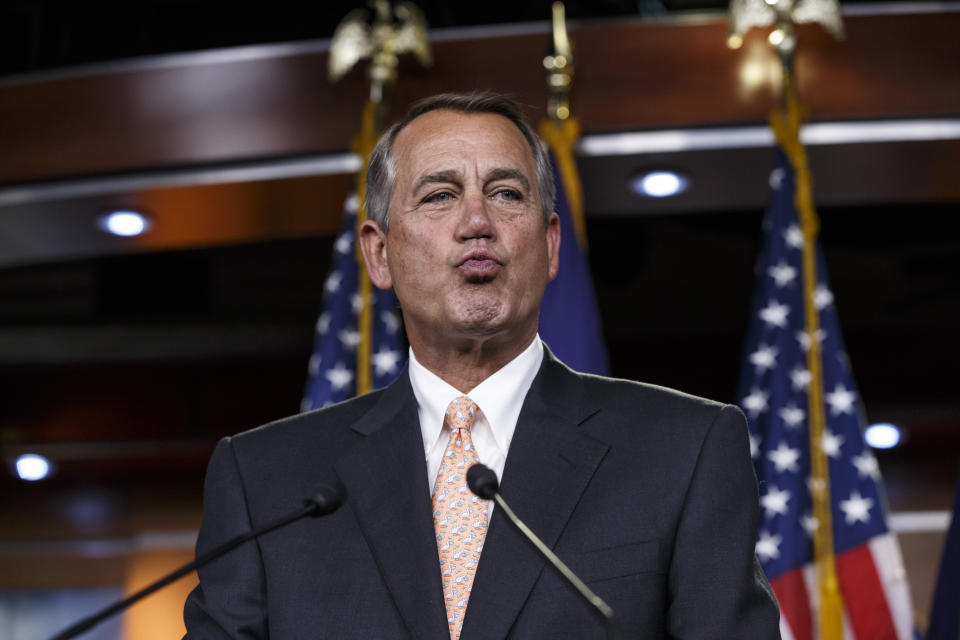 House Speaker John Boehner (R-Ohio) responds to reporters about the impasse over passing the Homeland Security budget because of Republican efforts to block President Barack Obama's executive actions on immigration on Feb. 26, 2015, during a news conference on Capitol Hill in Washington.