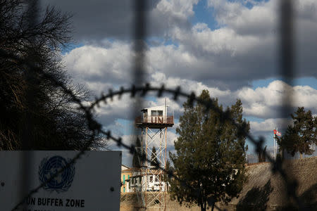 An abandoned UN outpost is seen behind the barbed wire inside the UN-controlled buffer zone in Nicosia, Cyprus February 16, 2017. REUTERS/Yiannis Kourtoglou