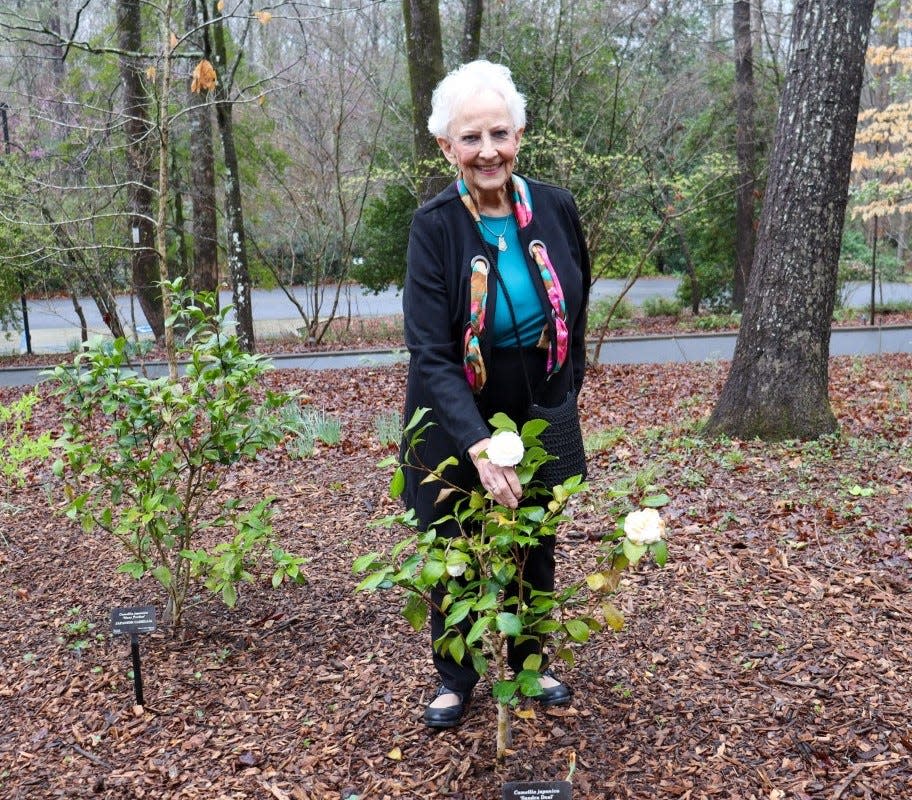 Former first lady of Georgia Sandra Deal poses at one of the young camellia shrubs planted at the State Botanical Garden of Georgia in Athens. Deal died on Tuesday of cancer.