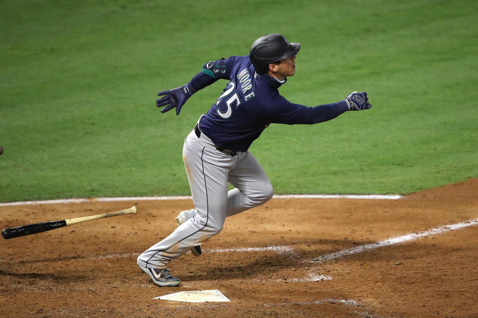 ANAHEIM, CALIFORNIA - JULY 29:  Dylan Moore #25 of the Seattle Mariners connects for a three-run homerun during the sixth inning of a game against the Los Angeles Angels at Angel Stadium of Anaheim on July 29, 2020 in Anaheim, California. (Photo by Sean M. Haffey/Getty Images)