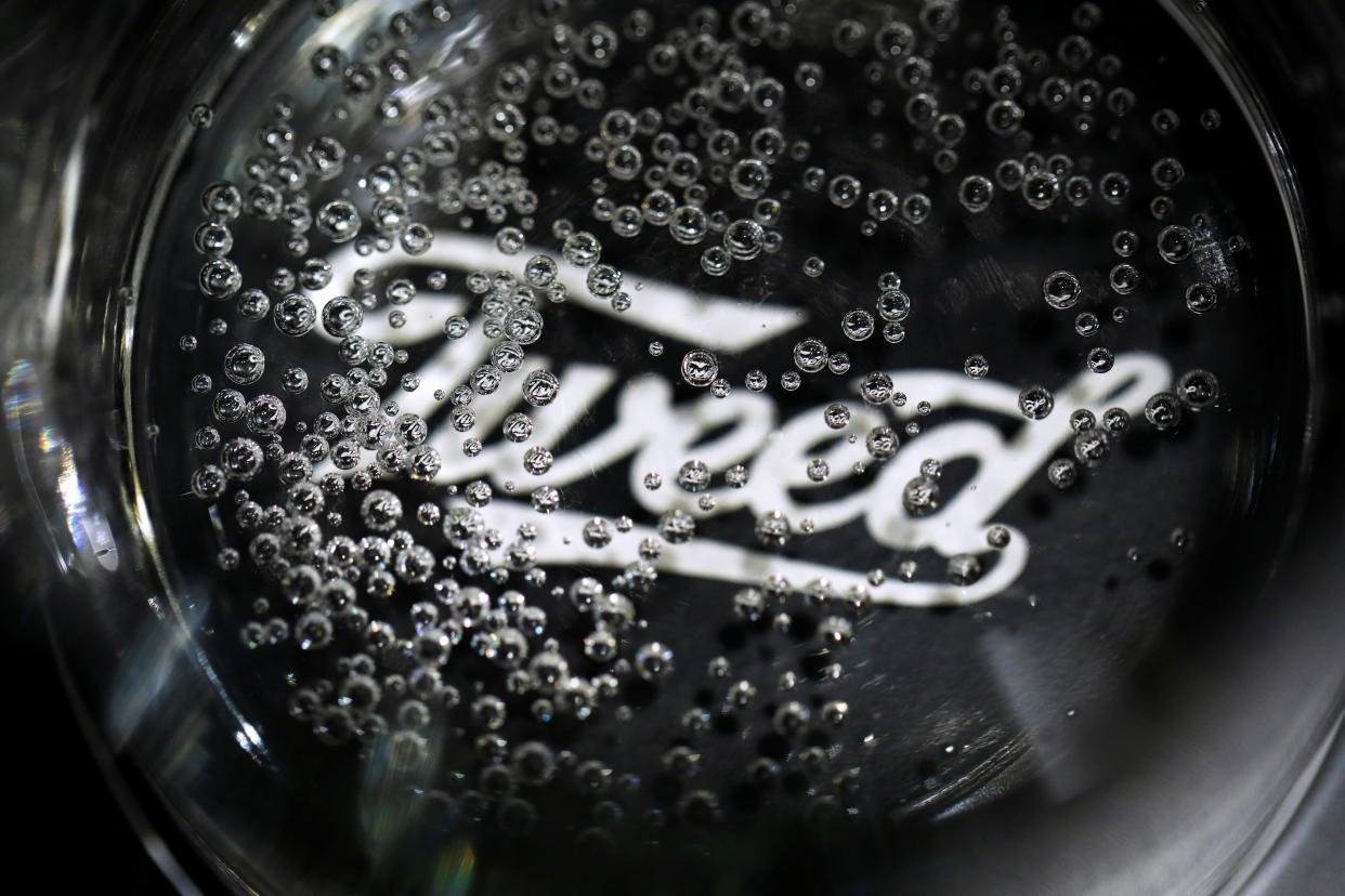 Bubbles in a sample beverage over a Tweed logo seen during a tour at a Canopy Growth facility that produces cannabis derivatives in Smiths Falls, Ontario, Canada October 29, 2019.  REUTERS/Blair Gable