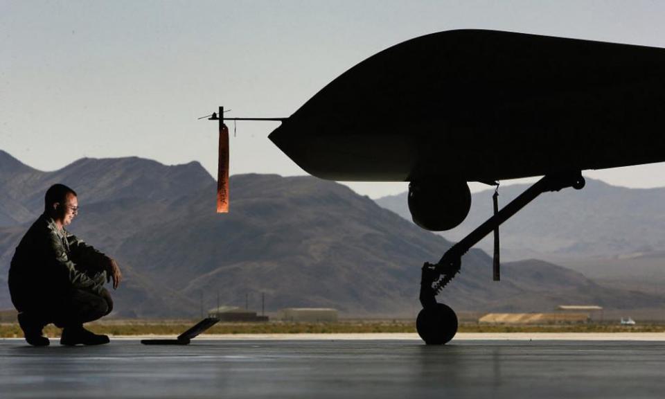 SSgt Christopher DeLucia checks a Predator drone at Creech Air Force Base in Indian Springs, Nevada.