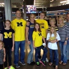 Mia Tuman (front right) grew up a Michigan fan with her father, Jerame, playing tight end for the Wolverines from 1995-98 and her mother growing up in metro Detroit.