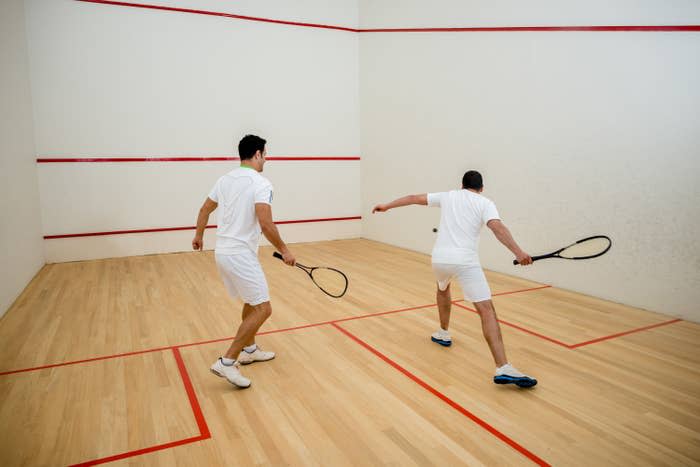 Two men playing squash