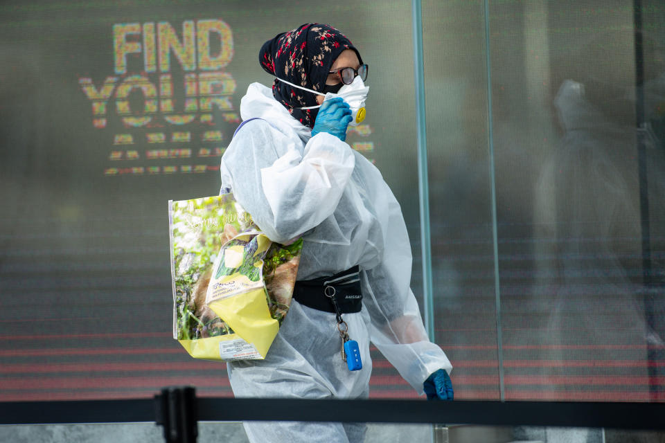 A shopper wearing a PPE suit arrives at Primark in Birmingham on Monday.