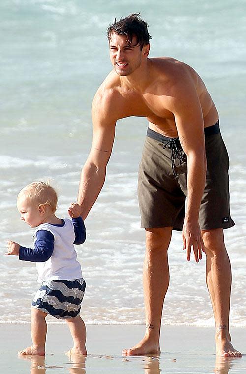 As he played with little George in the sand, the 30-year-old looked like a natural as he pulled funny faces to keep the bub entertained.