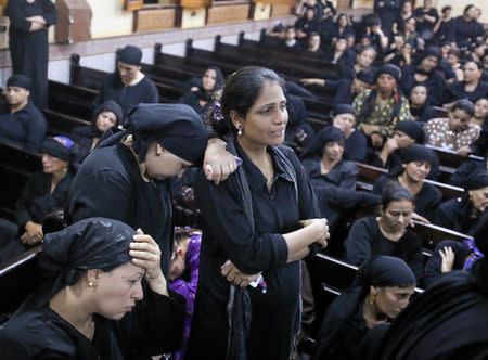 Mourners react at the Sacred Family Church for the funeral of Coptic Christians who were killed on Friday in Minya, Egypt, May 26, 2017. REUTERS/Mohamed Abd El Ghany
