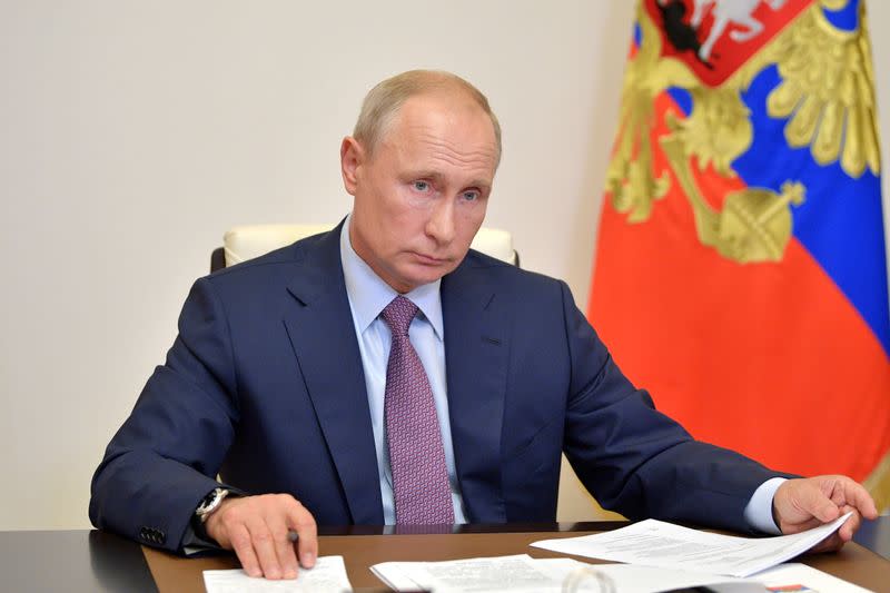 Russian President Putin takes part in a video conference call outside Moscow