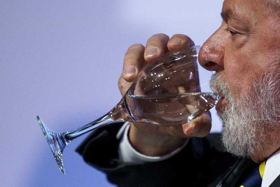 Brazilian President Luis Inacio Lula da Silva drinks water during a business meeting at the Casa America in Madrid, Spain, Tuesday, April 25, 2023. Brazil's President Luiz Inácio Lula da Silva visits Spain on Tuesday on the second stop of a European tour aimed at resetting relations and making progress on a long-delayed trade deal between the EU and the Mercosur bloc of Argentina, Brazil, Paraguay and Uruguay. (AP Photo/Manu Fernandez)