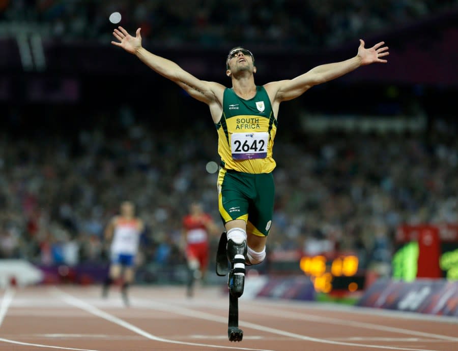 FILE – In this Sept. 8, 2012 file photo, South Africa’s Oscar Pistorius wins gold in the men’s 400-meter T44 final at the 2012 Paralympics in London. Pistorius could be granted parole on Friday, Nov. 24, 2023 after nearly 10 years in prison for killing his girlfriend. The double-amputee Olympic runner was convicted of a charge comparable to third-degree murder for shooting Reeva Steenkamp in his home in 2013. He has been in prison since late 2014. (AP Photo/Kirsty Wigglesworth, File)