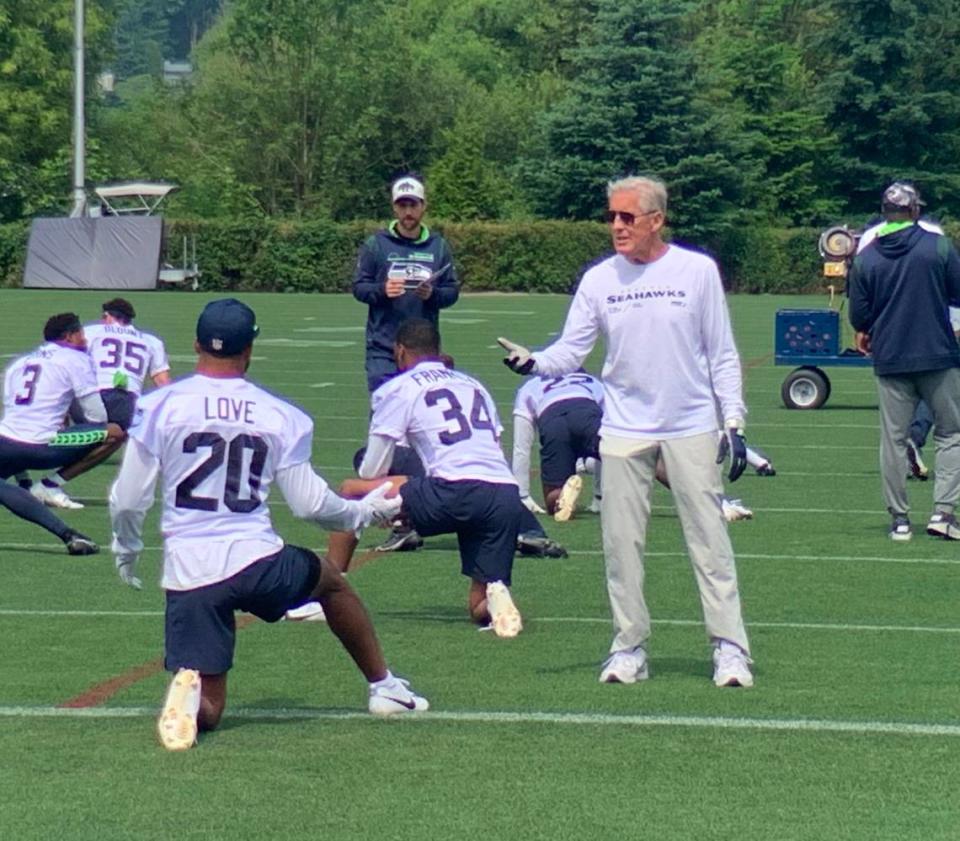 Coach Pete Carroll talks with new safety Julian Love at the third and final practice of Seahawks mandatory minicamp at the Virginia Mason Athletic Center in Renton June 8, 2023. Gregg Bell/The News Tribune