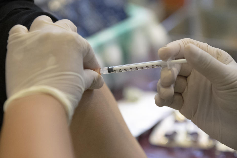 A health worker administers a dose of the Sinovac COVID-19 vaccine to a person at a shopping mall in Bangkok, Thailand, Monday, May 24, 2021. (AP Photo/Sakchai Lalit)