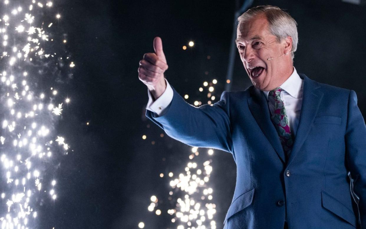 Nigel Farage addresses a Reform rally at the NEC centre in Birmingham on Sunday