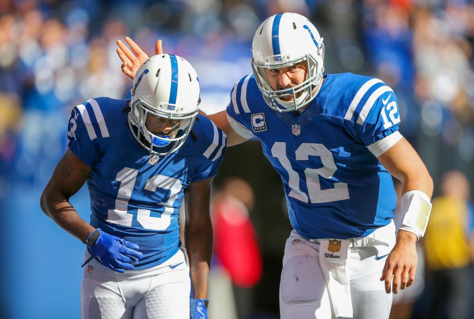 Indianapolis Colts wide receiver T.Y. Hilton (13) and quarterback Andrew Luck (12) celebrate the team's first score of the game during the second half of an NFL football game Sunday, Oct. 25, 2015, at Lucas Oil Stadium.