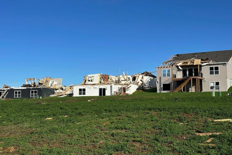 Debris surround destroyed and damaged homes in Elkhorn, Neb., on Saturday, April 27, 2024. Residents began sifting through the rubble after a tornado plowed through suburban Omaha, demolishing homes and businesses as it moved for miles through farmland and into subdivisions. (AP Photo/Nicholas Ingram)