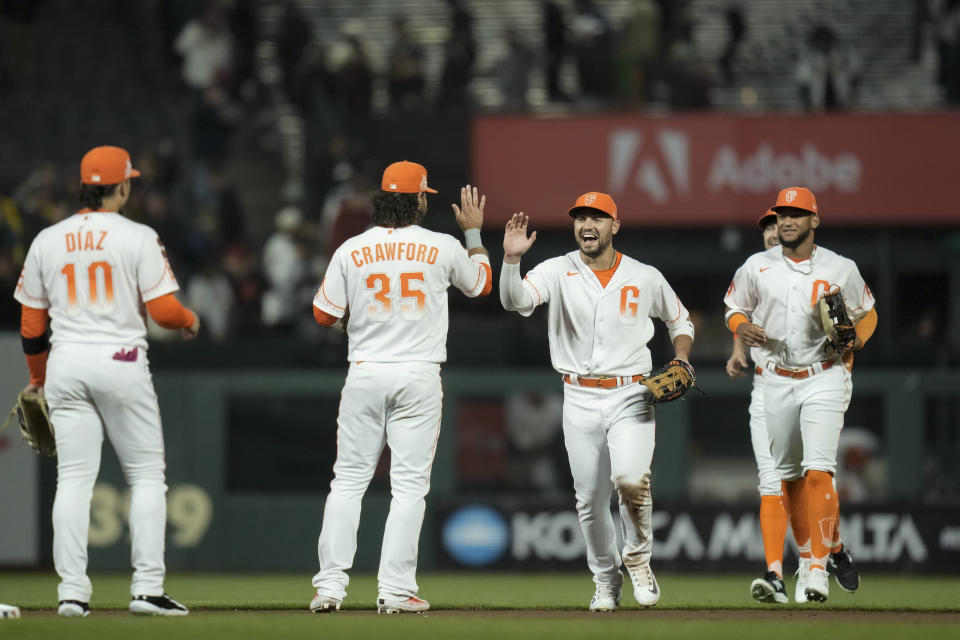 San Francisco Giants players celebrate after the team's 4-3 victory over the Arizona Diamondbacks in a baseball game Tuesday, Aug. 1, 2023, in San Francisco. (AP Photo/Godofredo A. Vásquez)