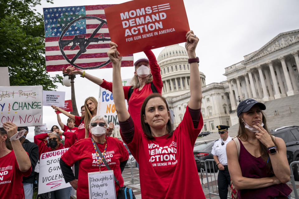 Activists join Senate Democrats outside the Capitol to demand action on gun control legislation after a gunman killed 19 children and two teachers in a Texas elementary school this week, in Washington, Thursday, May 26, 2022. A bipartisan group of senators is considering how Congress should respond to the horrific shooting of 19 children and two teachers in Uvalde, Texas. (AP Photo/J. Scott Applewhite)