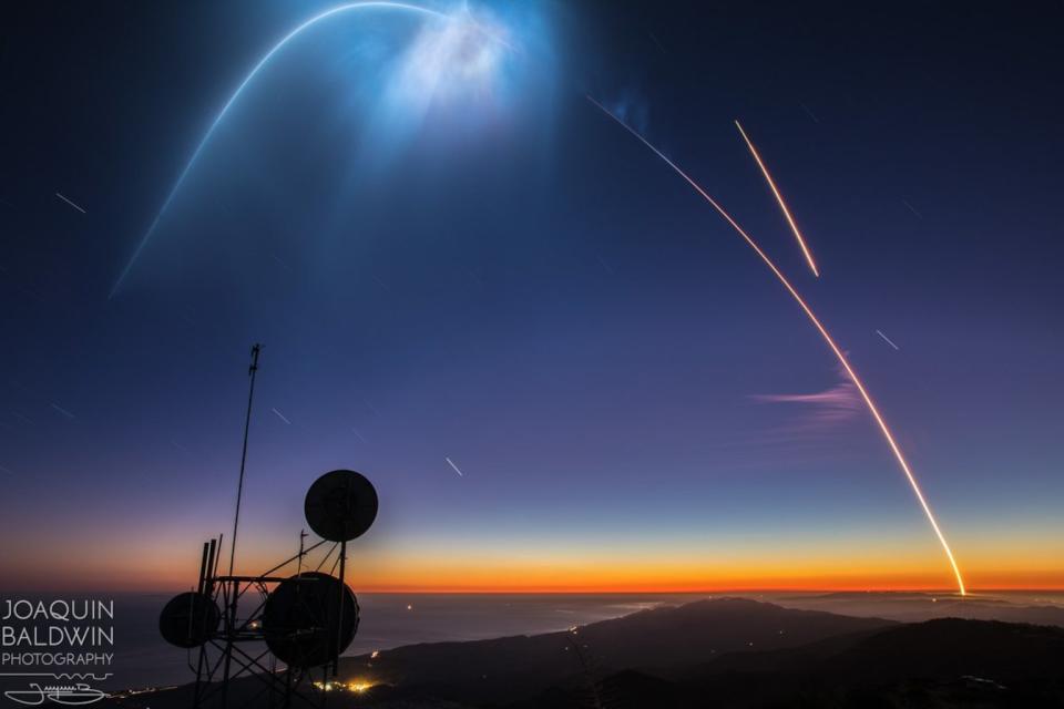 Photographer Joaquin Baldwin captured this spectacular image of SpaceX's successful Falcon 9 rocket launch and landing at Vandenberg Air Force Base in California on Oct. 7, 2018. The streak at top right is the Falcon 9 first stage returning to Earth. <cite>Joaquin Baldwin via <a href="https://twitter.com/joabaldwin" rel="nofollow noopener" target="_blank" data-ylk="slk:Twitter;elm:context_link;itc:0;sec:content-canvas" class="link ">Twitter</a> and <a href="https://www.instagram.com/joabaldwin/" rel="nofollow noopener" target="_blank" data-ylk="slk:Instagram;elm:context_link;itc:0;sec:content-canvas" class="link ">Instagram</a></cite>